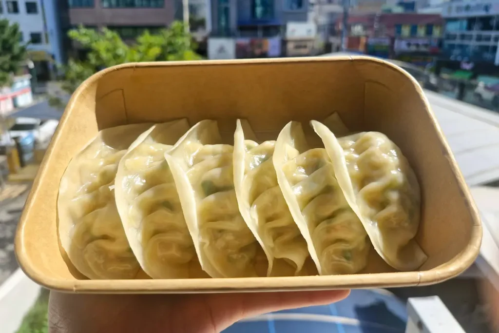 Thin-skinned Korean dumplings filled with meat and kimchi at Geoje Gohyeon Market.